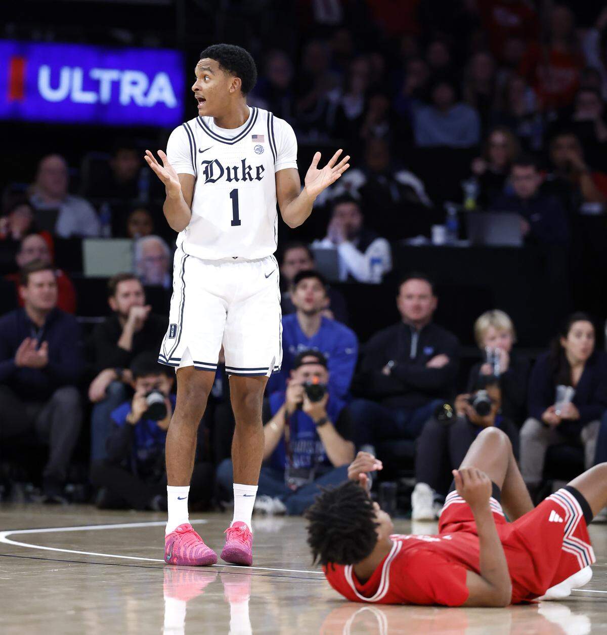 Duke’s Caleb Foster (1) can’t believe he was called for a foul as Texas Tech's Christian Anderson (4) makes a three in the second half of Texas Tech’s 82-81 victory over Duke in the SentinelOne Classic at Madison Square Garden in New York City, N.Y., Saturday, Dec. 20, 2025.