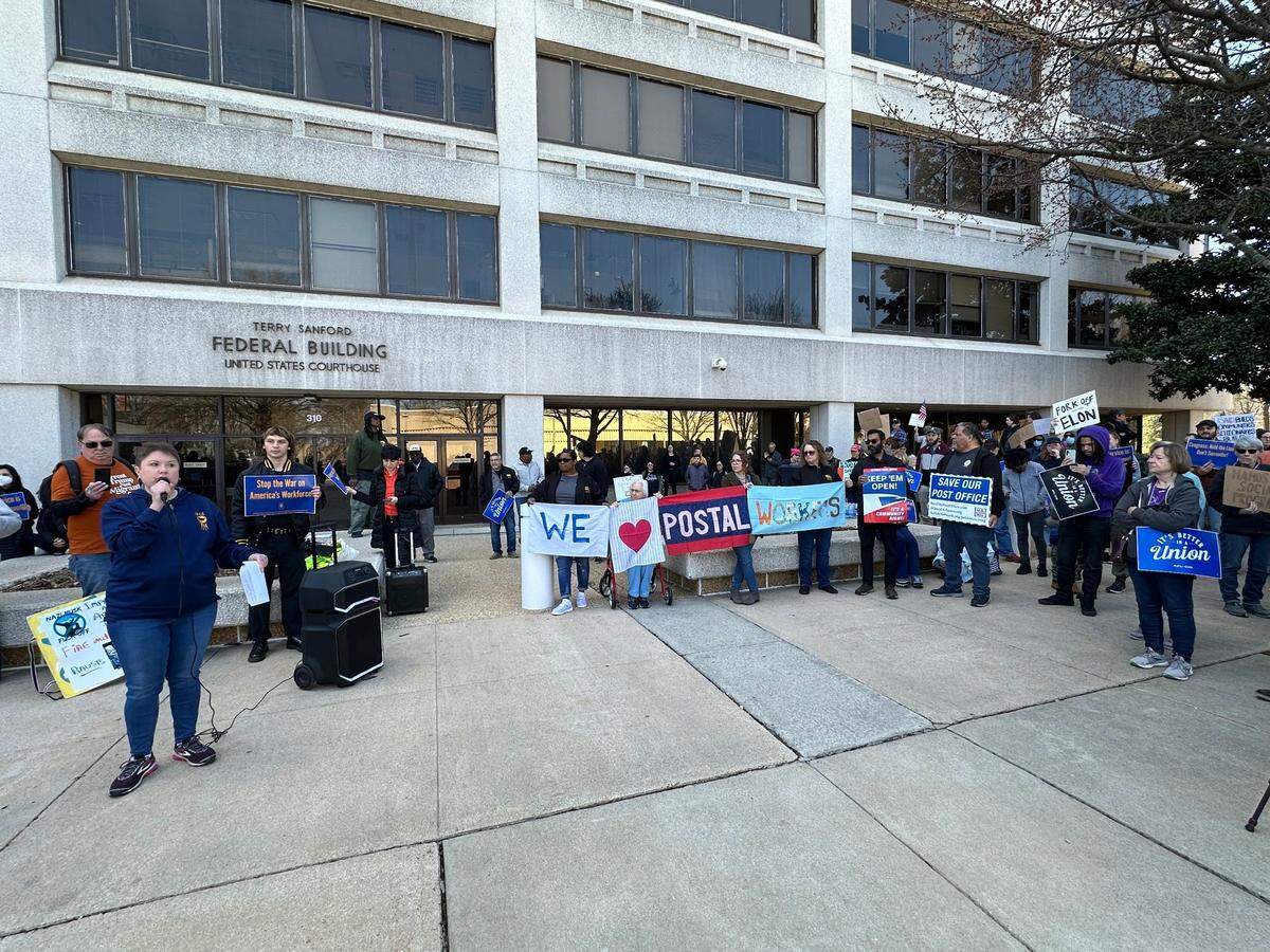 Heather Hughes, president of AFGE Local 3509, addresses federal government union workers and labor activists during a rally against the Trump administration’s efforts to shrink the federal workforce in downtown Raleigh, N.C. on Sunday, March 9, 2025.