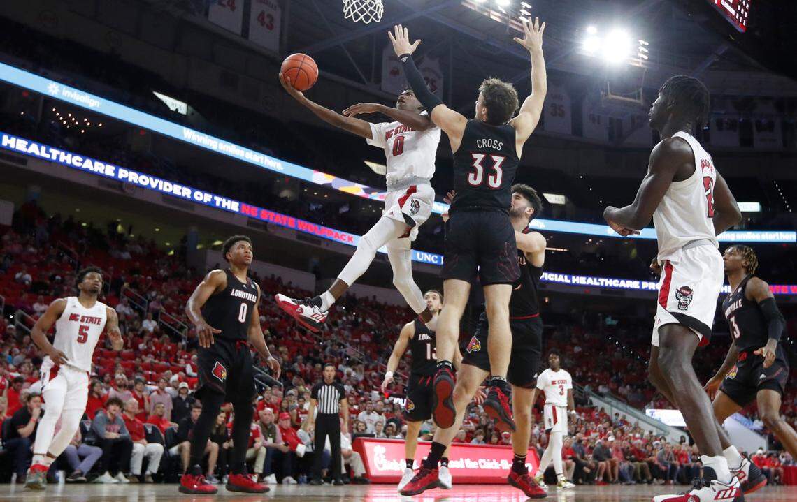 N.C. State’s Terquavion Smith (0) heads to the basket during Louisville’s 73-68 victory over N.C. State at PNC Arena in Raleigh, N.C., Saturday Dec. 4, 2021.