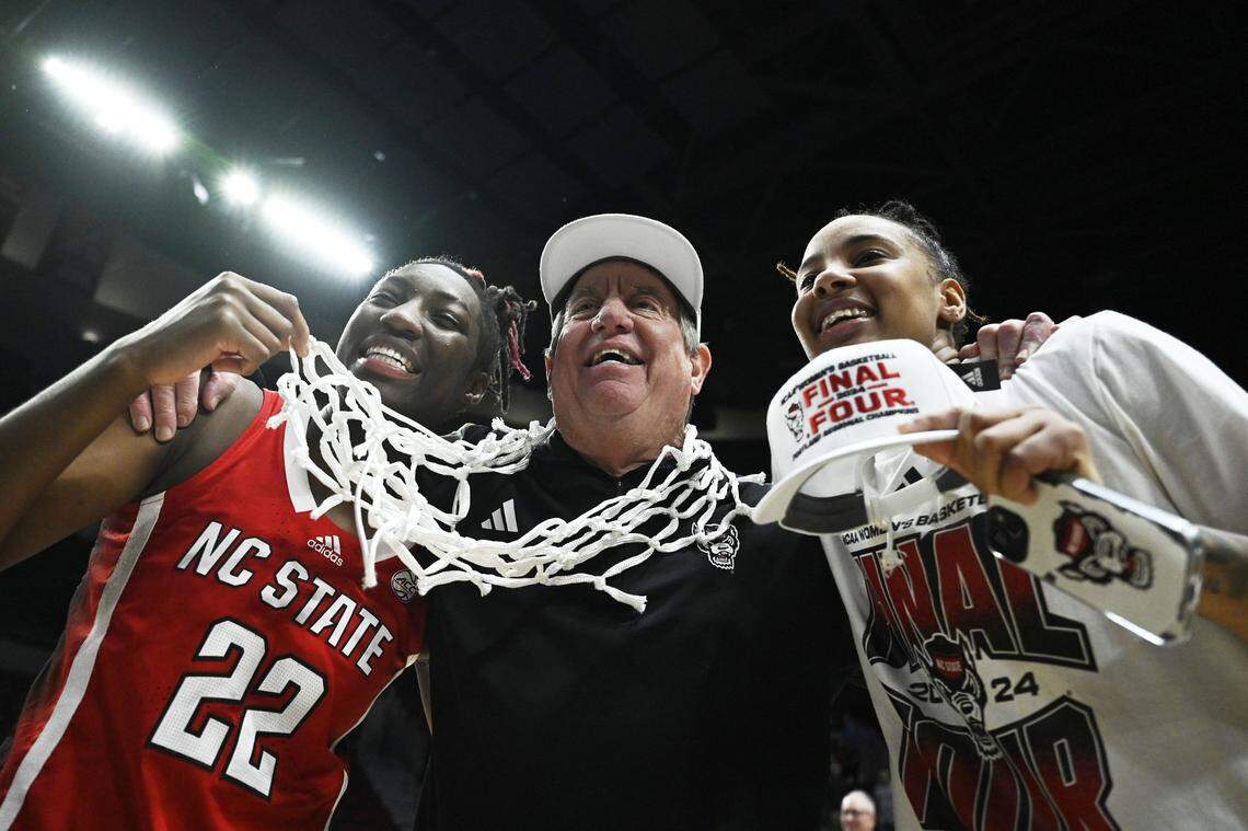Mar 31, 2024; Portland, OR, USA; NC State Wolfpack guard Saniya Rivers (22), head coach Wes Moore and guard Aziaha James (10) celebrate after a game against the Texas Longhorns in the finals of the Portland Regional of the NCAA Tournament at the Moda Center center. Mandatory Credit: Troy Wayrynen-USA TODAY Sports