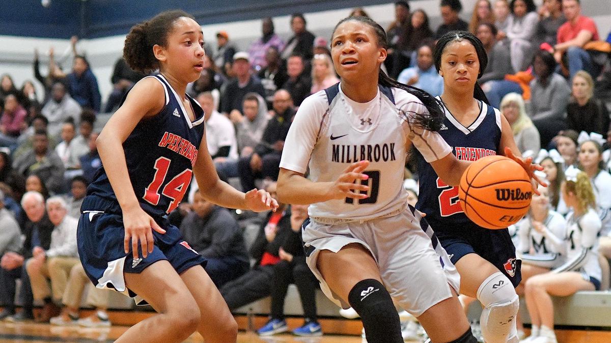 Millbrook’s Reiven Douglas (10) drives to the basket against Apex Friendship’s Victoria Sagne (14). The Apex Friendship Patriots and the Millbrook Wildcats met in a NCHSAA 4A fourth round game in Raleigh, N.C. on March 3, 2020.