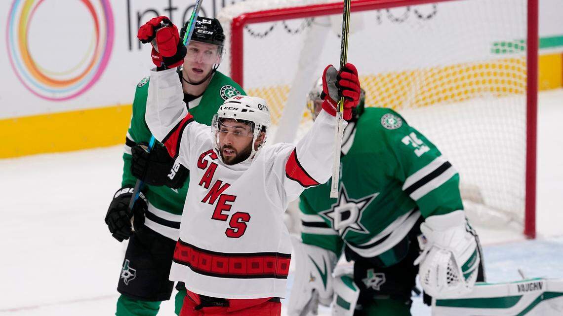 Carolina Hurricanes’ Vincent Trocheck (16) celebrates a goal scored by Brock McGinn as Dallas Stars’ Esa Lindell (23) and Anton Khudobin (35) look on in the second period of an NHL hockey game in Dallas, Thursday, Feb. 11, 2021. (AP Photo/Tony Gutierrez)