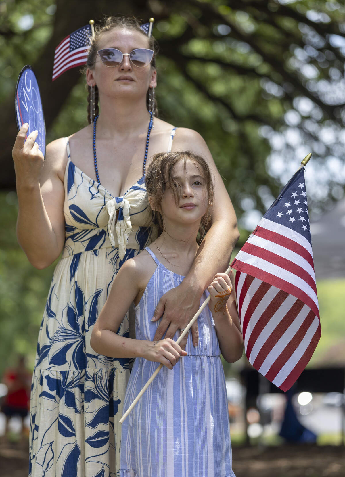 Courtney Reid and her eight-year-old daughter Adaline Reid of Vass, NC stand for the National Anthem during the Freedom Fest 250, celebrating the country’s Semiquincentennial, on Saturday, July 4, 2026 in Raleigh, N.C.