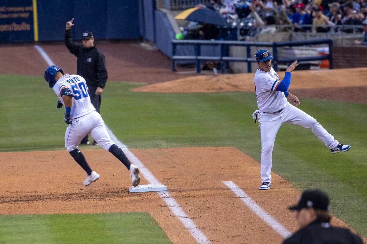 René Pinto, 50, rounds the bases after hitting a home run during the Durham Bulls season opener against the Norfolk Tides, Friday March 31, 2023 at the Durham Bulls Athletic Park.