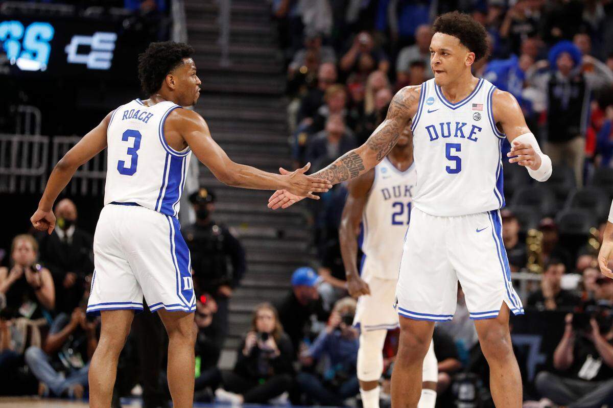 Duke’s Jeremy Roach (3) and Paolo Banchero (5) celebrate during the second half of Duke’s 78-73 victory over Texas Tech in the Sweet 16 round of the NCAA Tournament at the Chase Center in San Francisco, Calif., Thursday, March 24, 2022.