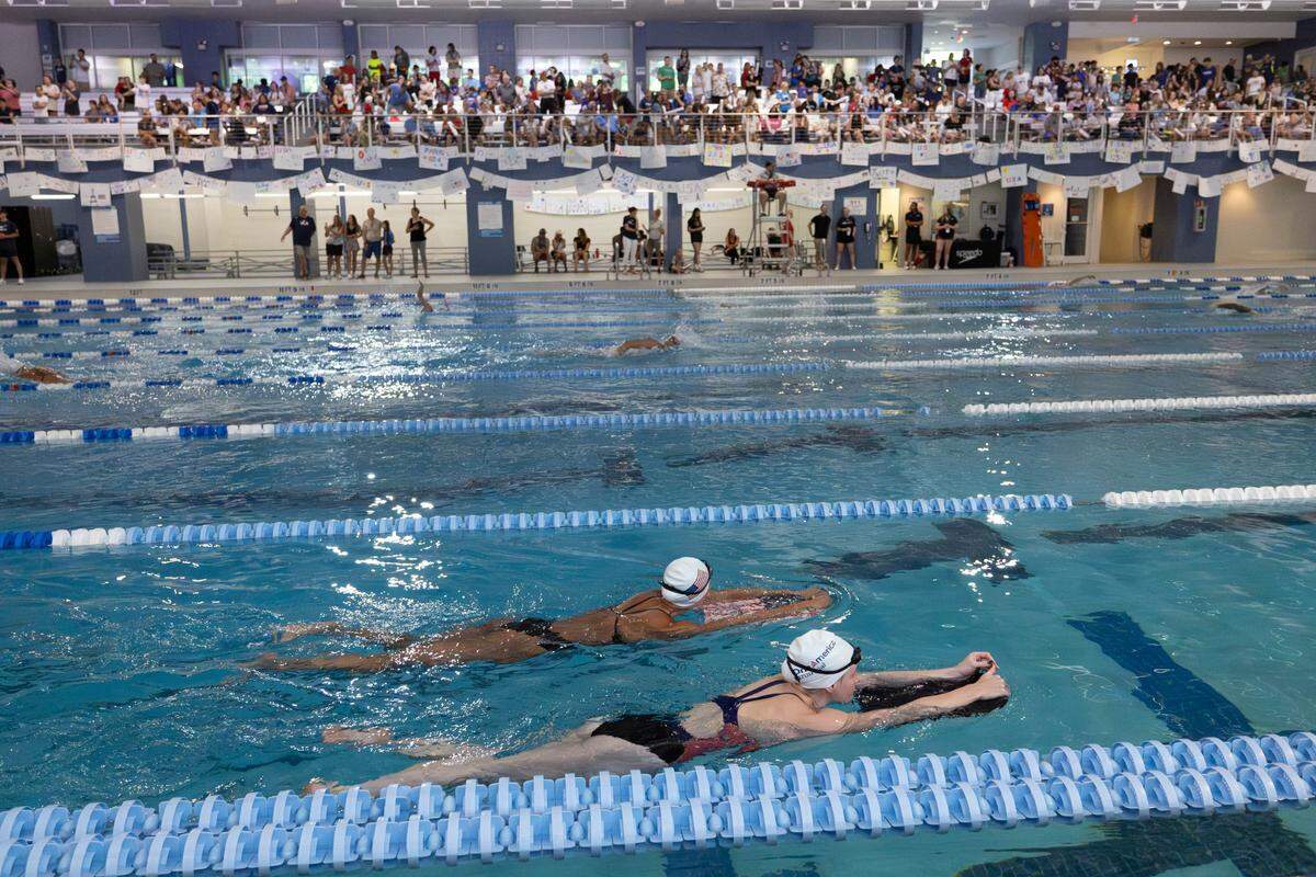 Fans fill the viewing area as they watch the United States Olympic Swim Team train for the 2024 Paris Olympics at the Triangle Aquatic Center in Cary, N.C. on Saturday, July 6, 2024.