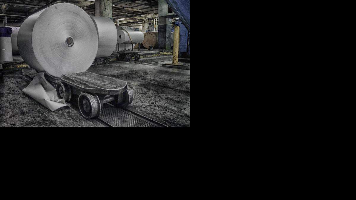 Paper rolls wait to be loaded onto a dolly for the trip to The News & Observer’s press in downtown Raleigh.
