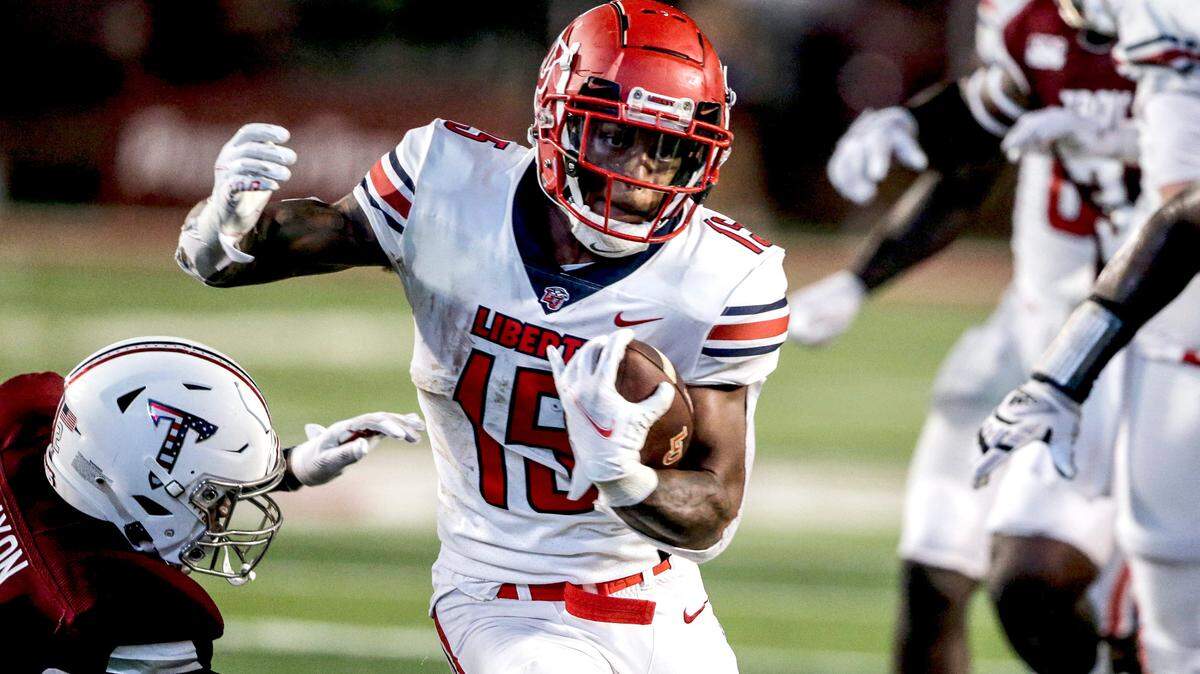 Liberty running back T.J. Green (15) caries the ball during a game against Troy on Sept. 11, 2021, in Troy, Ala.