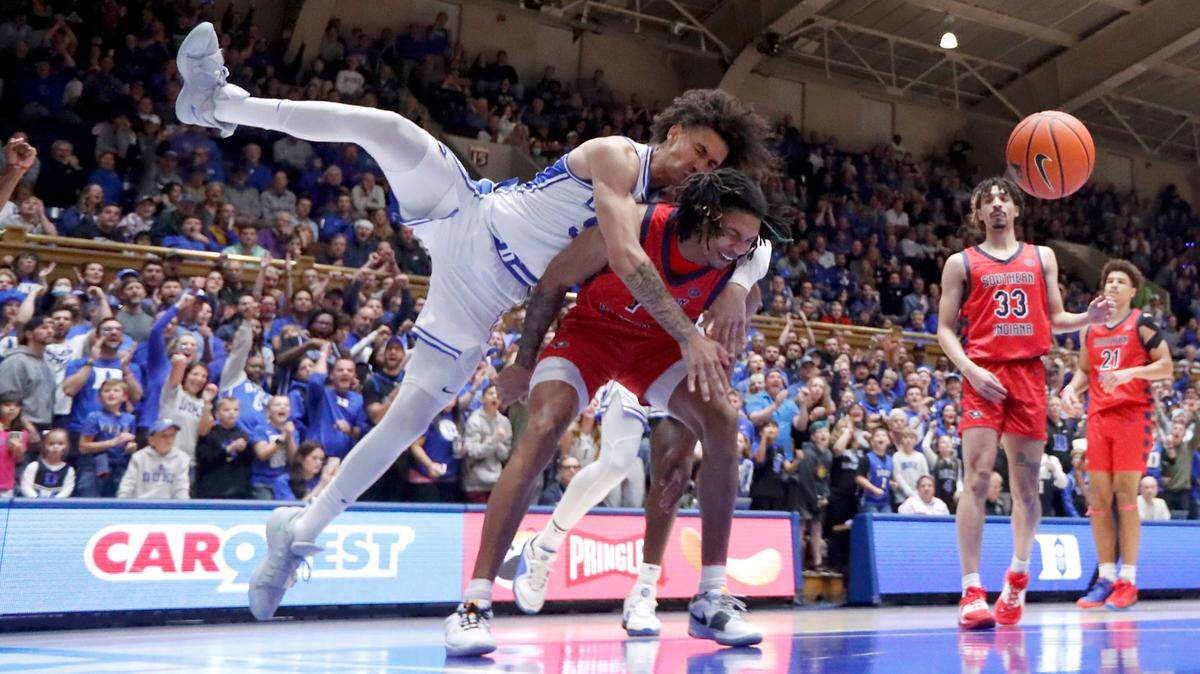 Southern Indiana’s Javius Moore (1) fouls Duke’s Tyrese Proctor (5) after Proctor dunked the ball during Duke’s 80-62 victory over Southern Indiana at Cameron Indoor Stadium in Durham, N.C., Friday, Nov. 24, 2023. Moore and Proctor were both called for a technical.