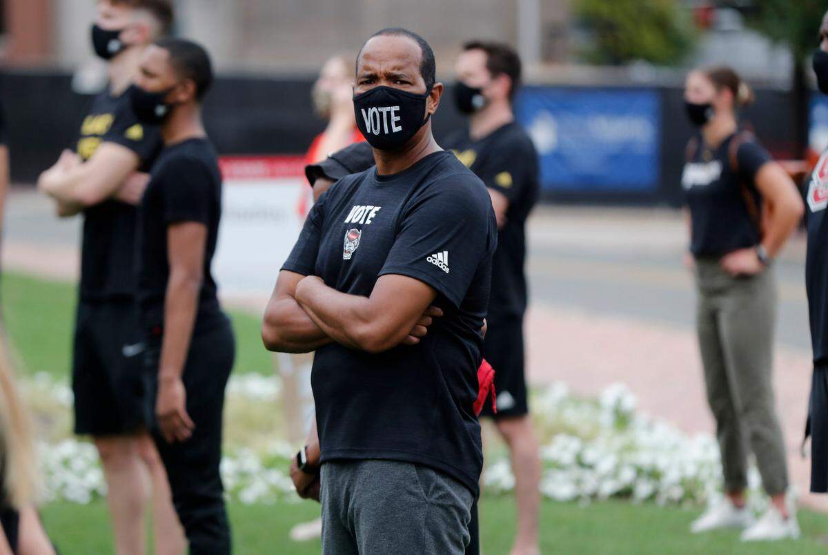 N.C. State men’s basketball coach Kevin Keatts listens during a #PackUnited peaceful protest against racial and social injustice outside Holladay Hall on the campus of N.C. State Saturday, Sept. 12, 2020.