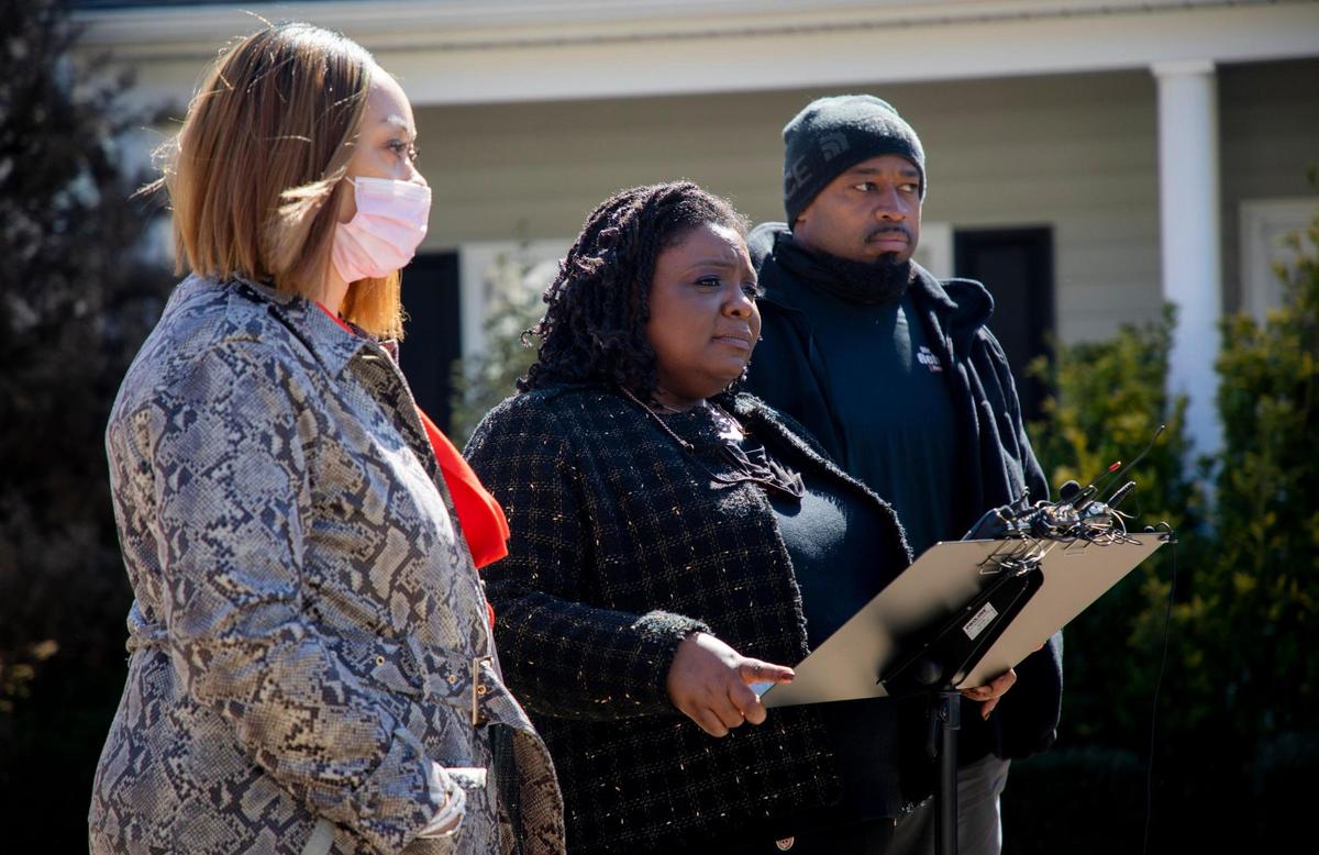 Dawn Blagrove, center, executive director of Emancipate NC, holds a press conference with the parents of 14-year-old Malcolm Ziglar, Ty Ziglar, left, and Sharndell Ziglar, in response to his treatment by the Fuquay-Varina Police Department who detained him and accused of him of stealing a dirt bike, on Monday, Mar. 8, 2021, in Fuquay-Varina, N.C.