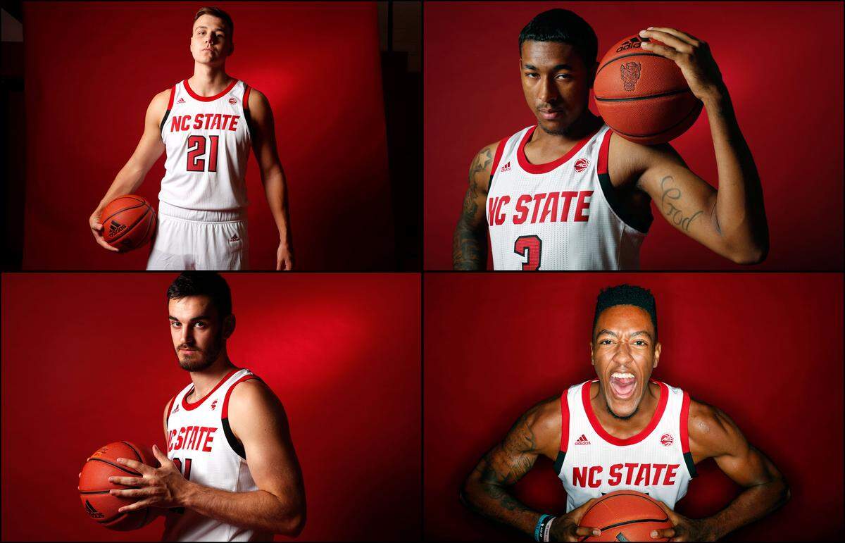 N.C. State players, clockwise from top left, Danny Dixon (21), A.J. Taylor (3), Manny Bates (12) and Pat Andree (31) pose during N.C. State basketball’s media day in Raleigh, N.C., Thursday, October 3, 2019.