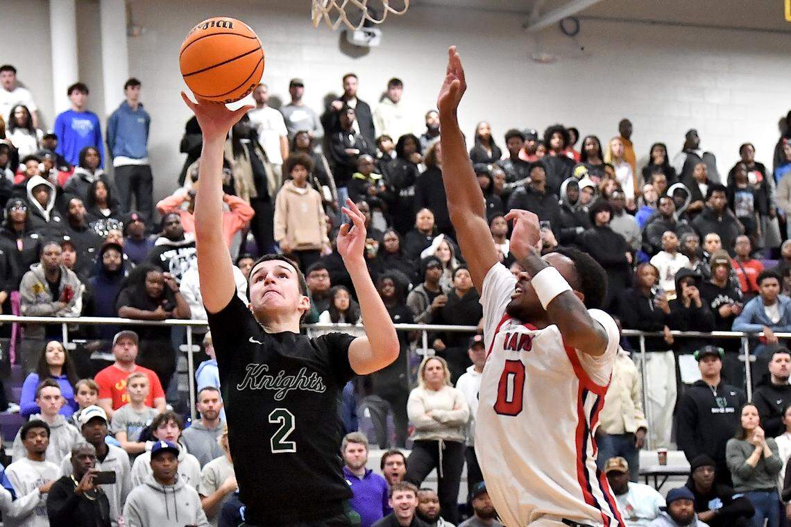 Greenfield's Johnny Winborne (2) attempts the layup against Coronado's Jonny Collins (0) during the second half. The Greenfield Knights and the Coronado Cougars (Nevada) met in the finals of the Day'Ron Sharpe bracket of the  John Wall Holiday Tournament in Raleigh, N.C. on December 30, 2025.