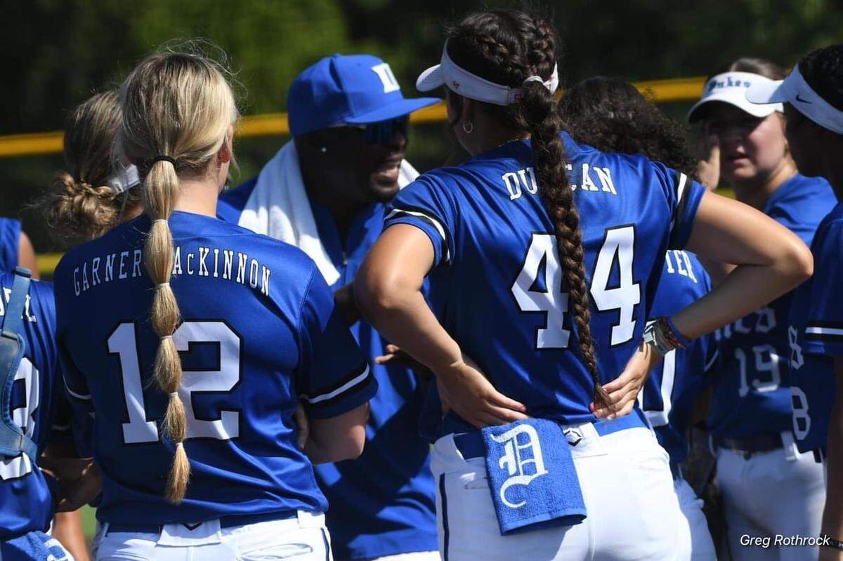 James Lamar coaches players in the Lady Dukes youth softball program. Husband of Duke Blue Devils softball coach Marissa Young, Lamar is awaiting heart and kidney transplants.