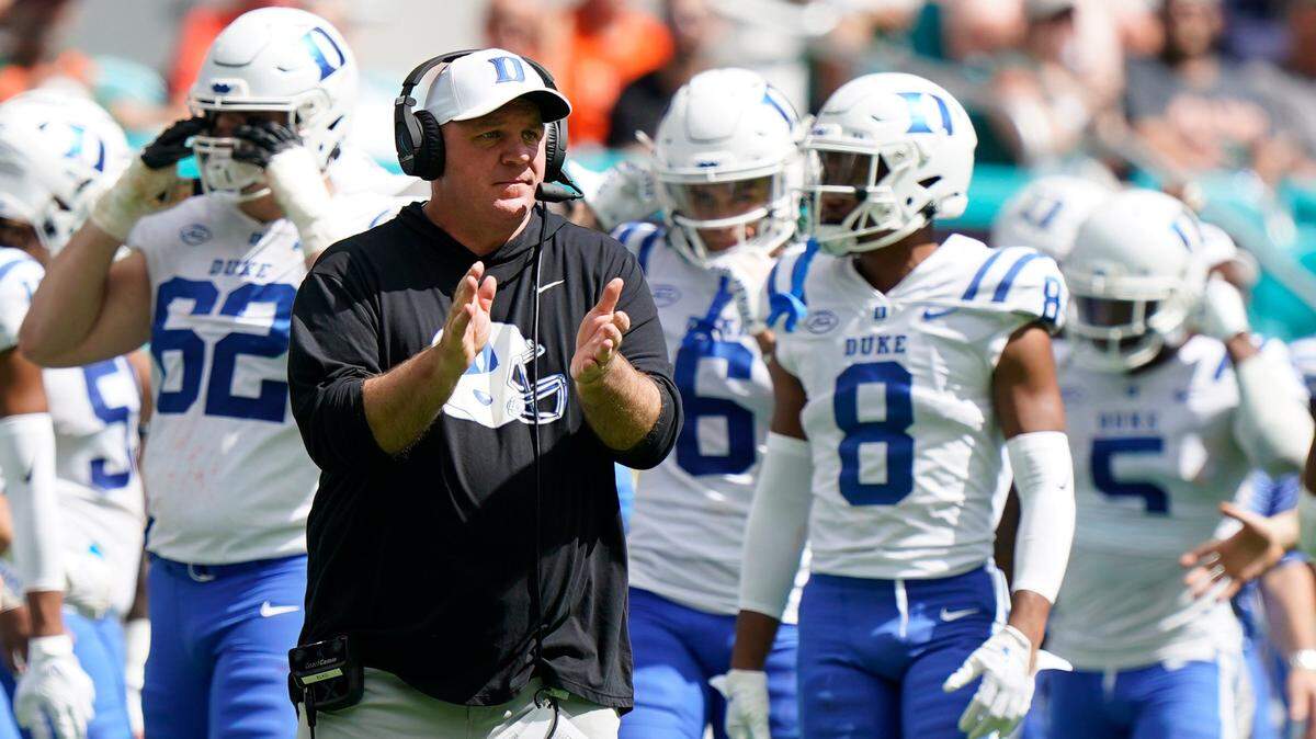 Duke head coach Mike Elko watches from the sidelines during the first half of an NCAA college football game against Miami, Saturday, Oct. 22, 2022, in Miami Gardens, Fla. (AP Photo/Wilfredo Lee)
