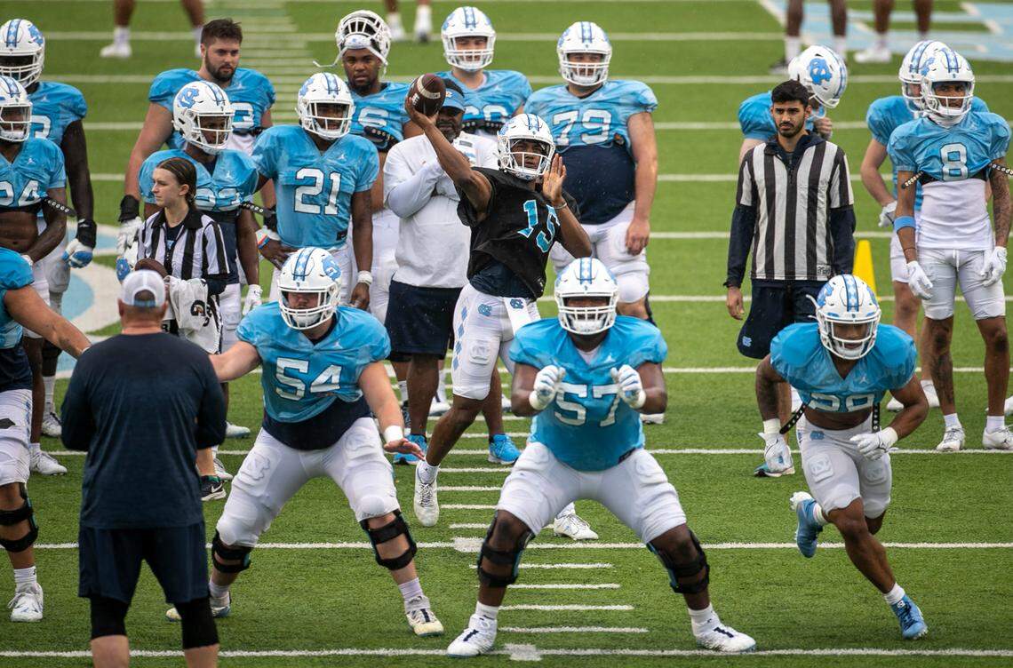 North Carolina quarterback Corner Harrell (15) unleashes a long pass at the Tar Heels’ open practice on Saturday, March 25, 2023 at Kenan Stadium in Chapel Hill. N.C.