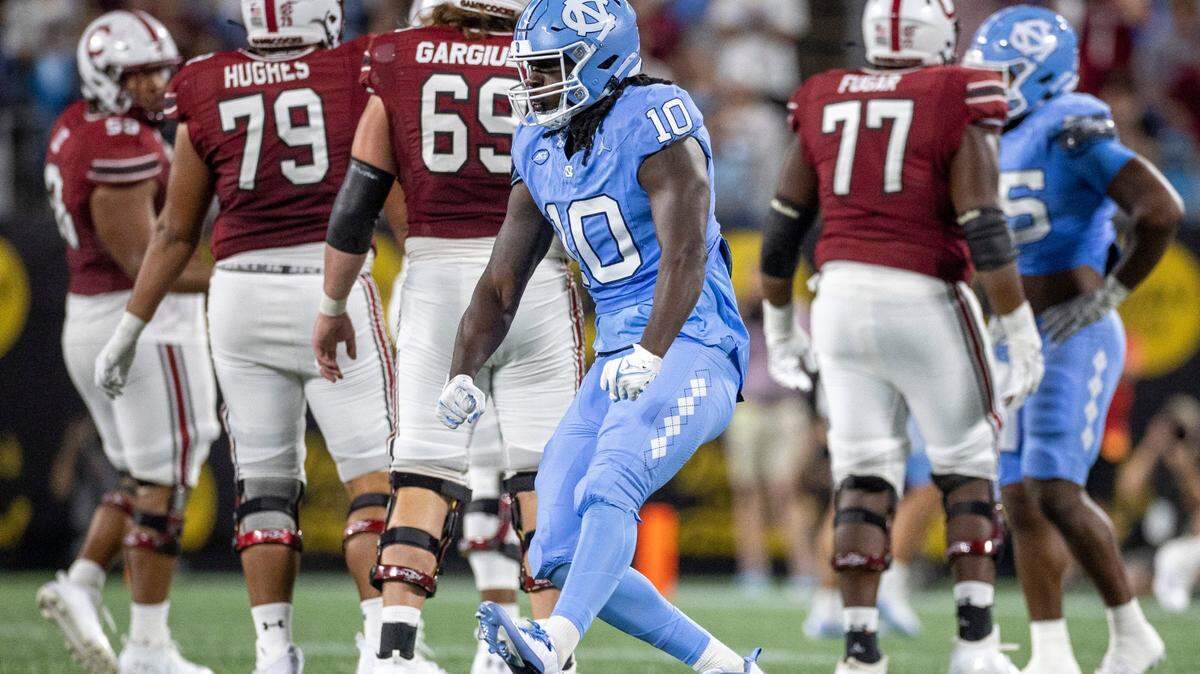 North Carolina’s Desmond Evans (10) reacts after a sack of South Carolina quarterback Spencer Rattler (7) for a nine-yard loss in the third quarter on Saturday September 2, 2023 at Bank of America Stadium in Charlotte, N.C.