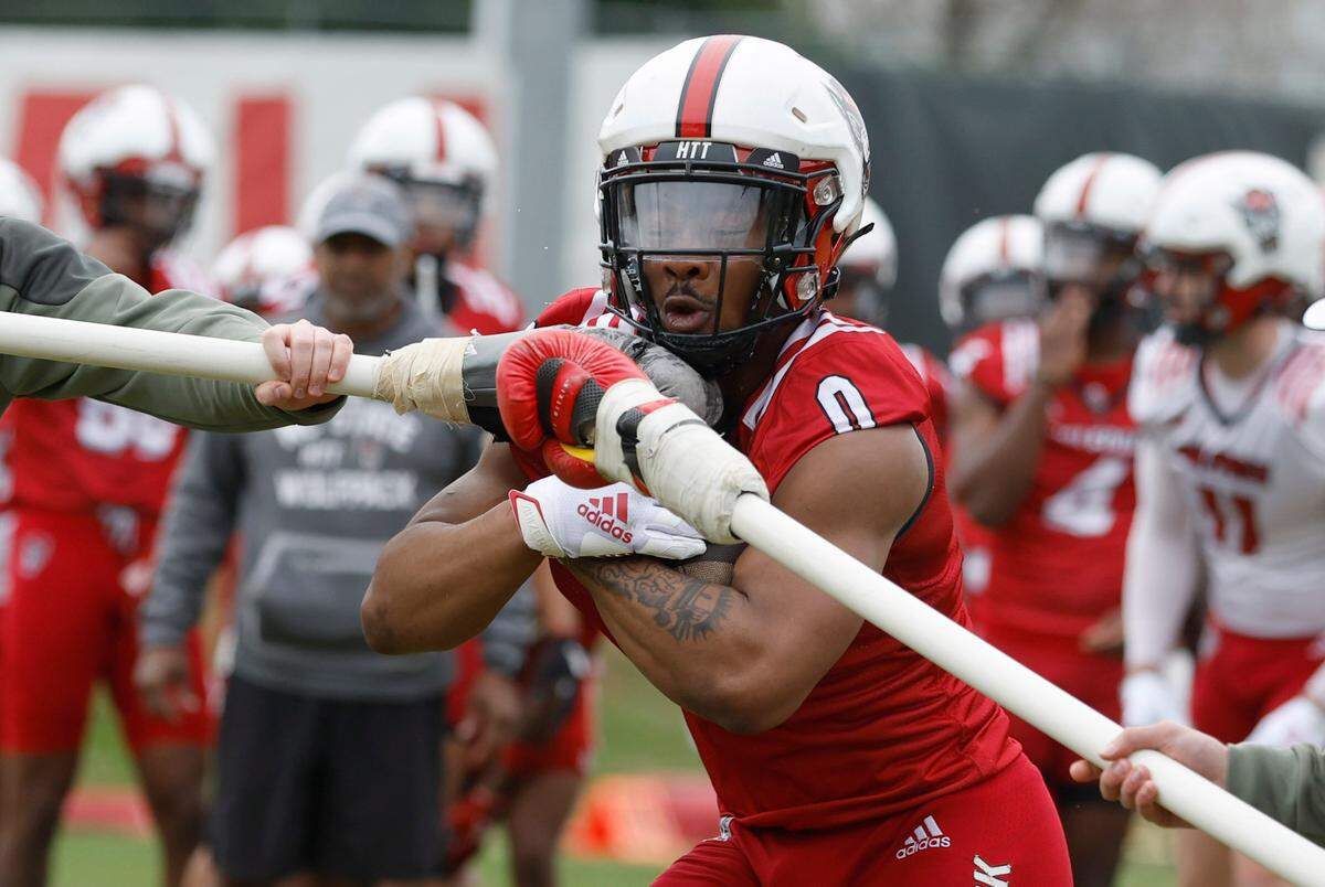 N.C. State running back Demie Sumo-Karngbaye (0) runs a drill during the Wolfpack’s first spring practice in Raleigh, N.C., Wednesday, March 1, 2023.