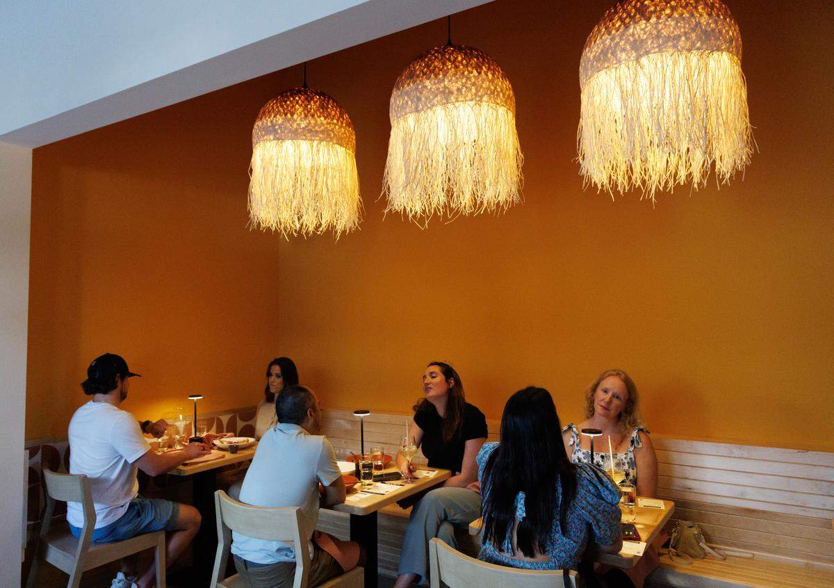 People dine at Mala Pata during a soft opening on Tuesday, May 6, 2025, in Raleigh, N.C. The restaurant plans to open on May 14 at Raleigh’s Gateway Plaza.
