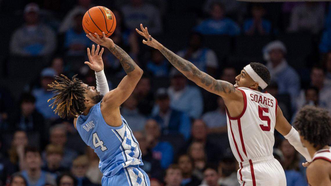 North Carolina’s R.J. Davis (4) puts up a shot against Oklahoma’s Rivaldo Soares (5) in the second half on Wednesday, December 20, 2023 at the Spectrum Center in Charlotte, N.C. Davis scored 23 points in the Tar Heels’ 81-69 victory.