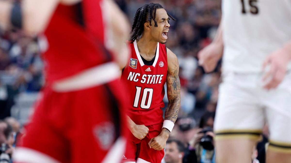 N.C. State’s Breon Pass (10) celebrates hitting a basket during the first half of N.C. State’s game against Purdue in the NCAA Tournament national semfinals at State Farm Stadium in Glendale, Ariz., Saturday, April 6, 2024.