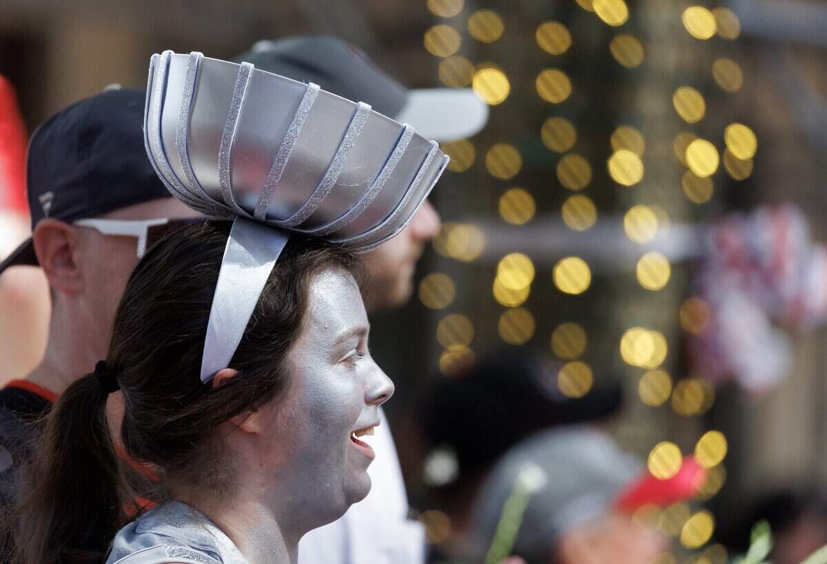 Megan Collins smiles while wearing a Stanley Cup hat prior to a parade honoring the Carolina Hurricanes’ Stanley Cup Championship on Saturday, June 20, 2026, in Raleigh, N.C.