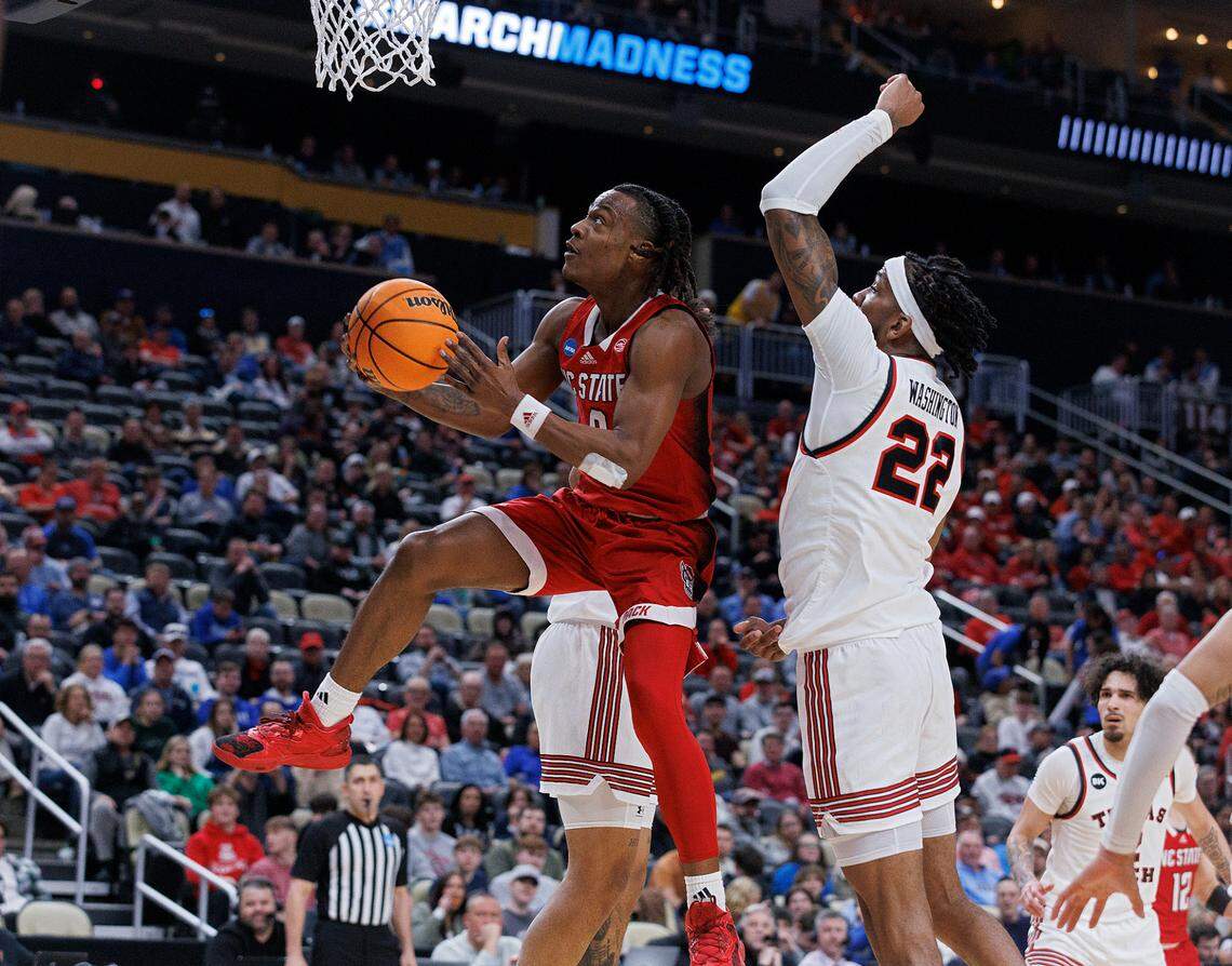 N.C. State’s DJ Horne drives to the basket past Texas Tech’s Warren Washington during the first half of the Wolfpack’s 80-67 win in the first round of the NCAA Tournament on Thursday, March 21, 2024, at PPG Paints Arena in Pittsburgh, Pa.