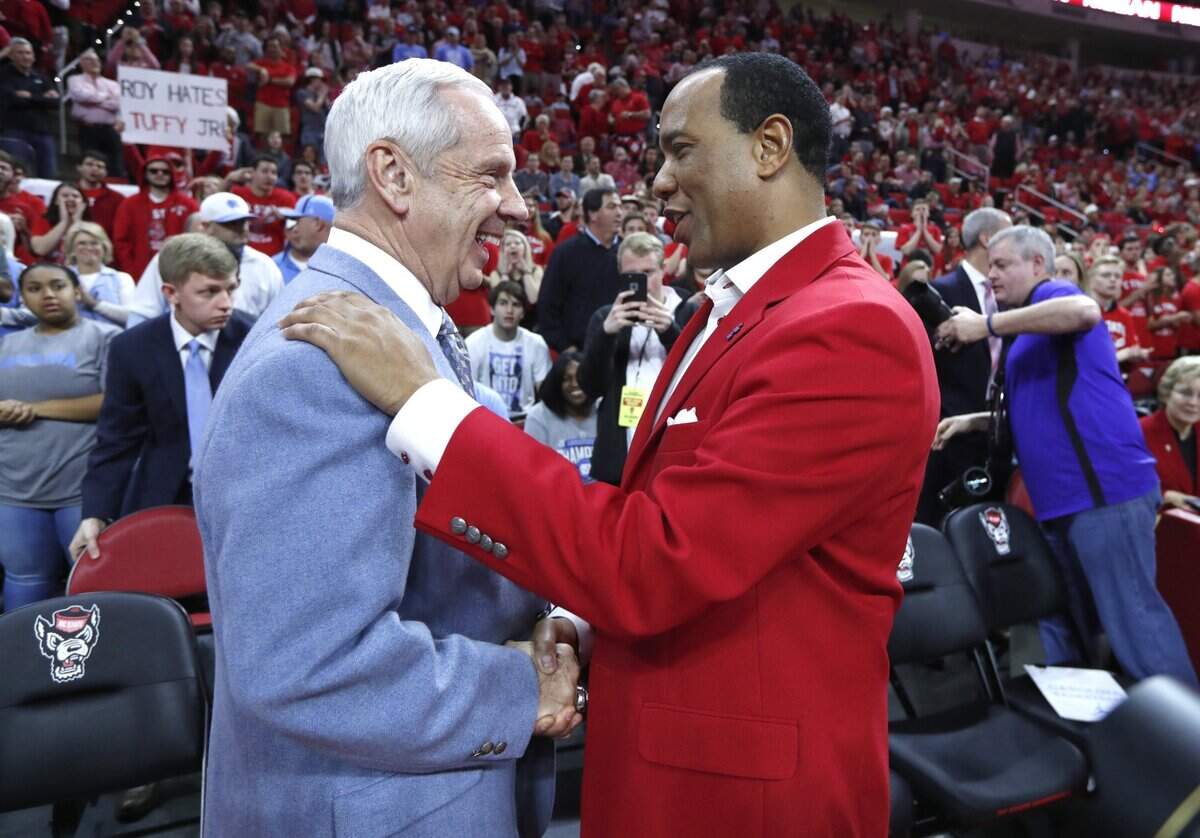 N.C. State head coach Kevin Keatts greets North Carolina head coach Roy Williams before N.C. State’s game against UNC at PNC Arena in Raleigh, N.C., Saturday, Feb. 10, 2018.