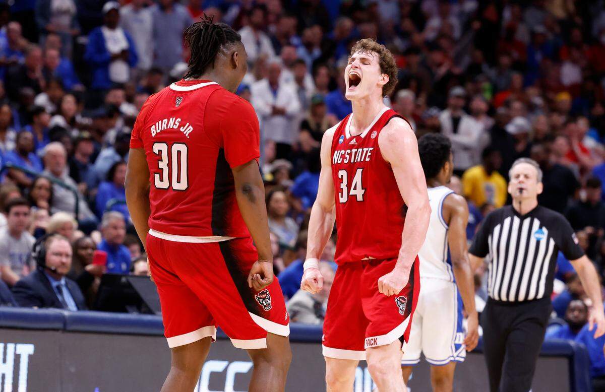 N.C. State’s DJ Burns Jr. (30) celebrates with Ben Middlebrooks (34) during the second half of N.C. State’s 76-64 victory over Duke in their NCAA Tournament Elite Eight matchup at the American Airlines Center in Dallas, Texas, Sunday, March 31, 2024.