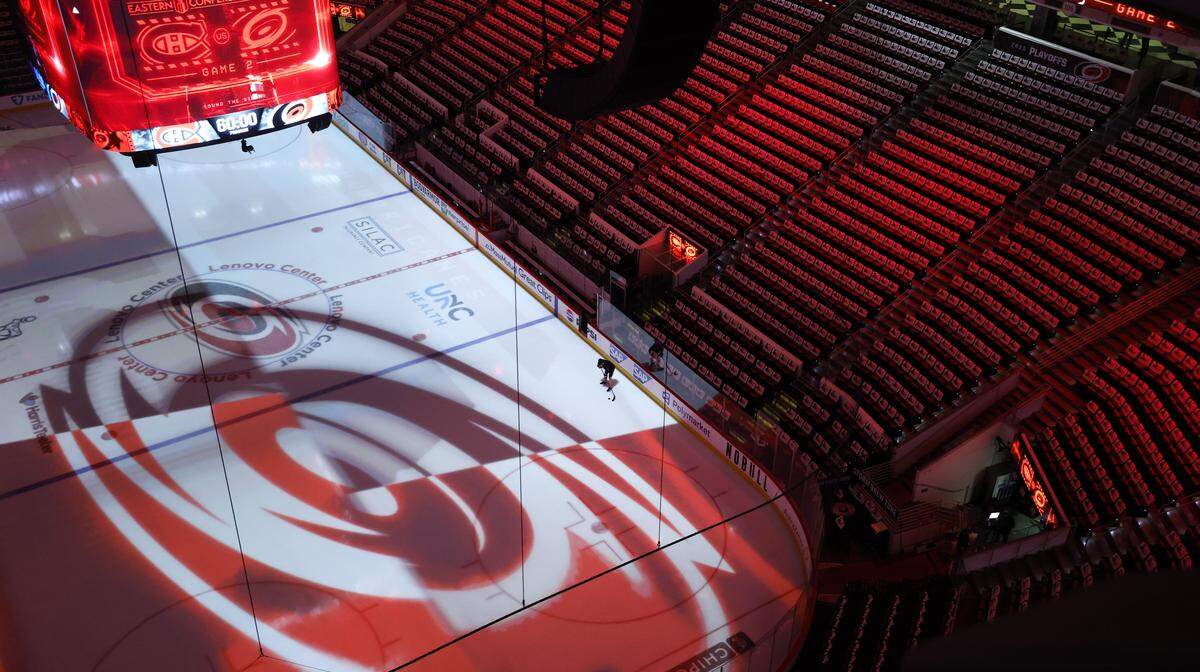 A player works on the ice before the Hurricanes’ game against the Canadiens in game two of the Eastern Conference Finals at the Lenovo Center in Raleigh, N.C., Saturday, May 23, 2026.