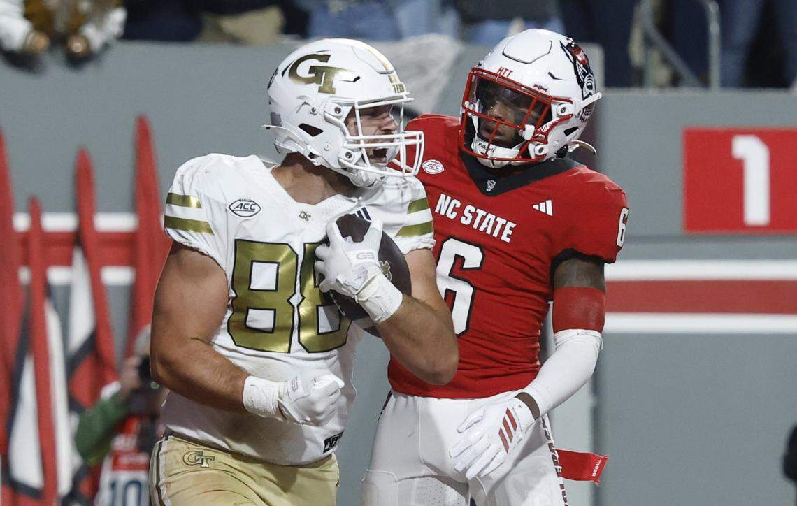 Georgia Tech tight end J.T. Byrne (88) celebrates scoring on a two-yard touchdown reception in front of N.C. State defensive back Devon Marshall (6) during the first half of N.C. State’s game against Georgia Tech at Carter-Finley Stadium in Raleigh, N.C., Saturday, Nov. 1, 2025.