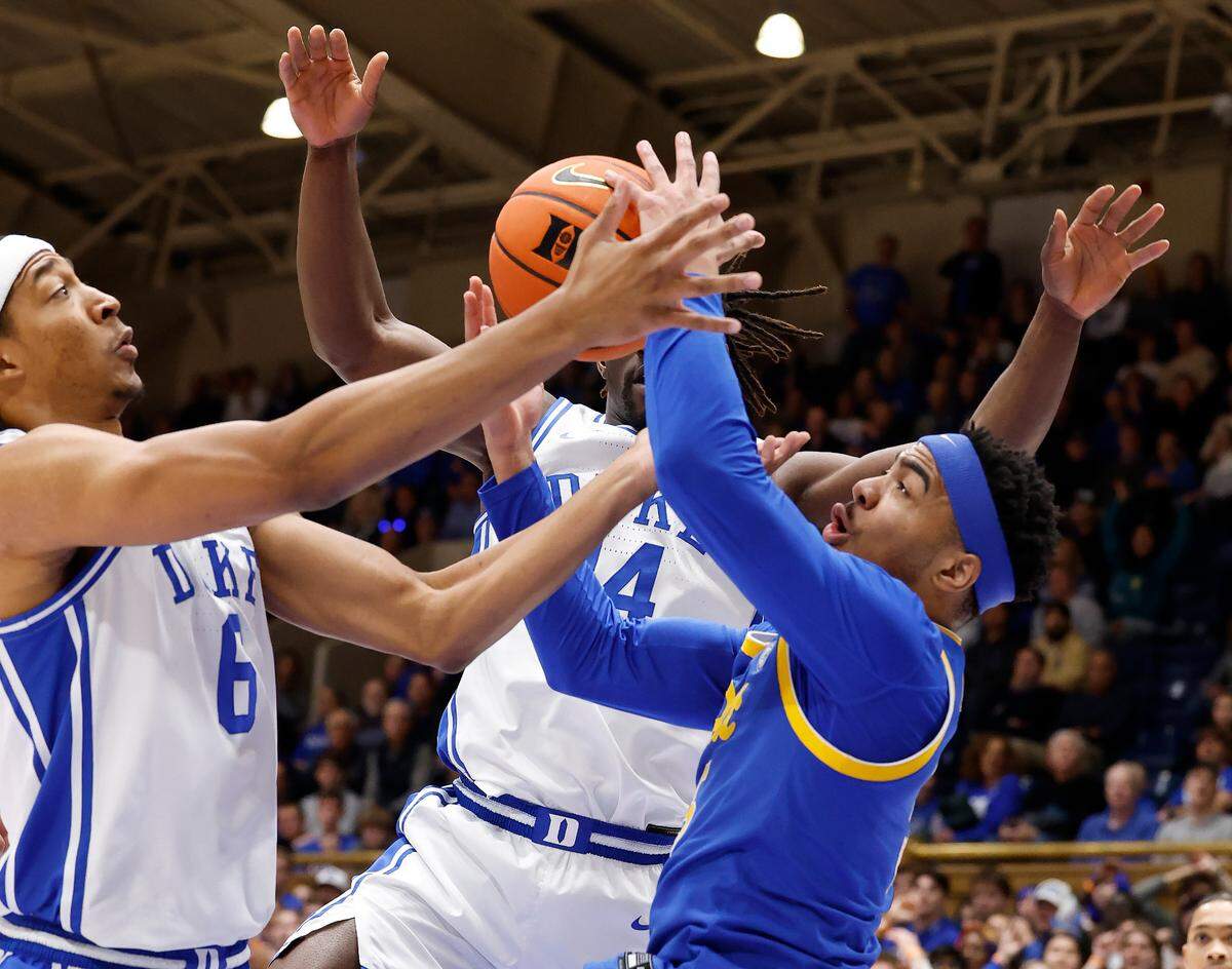 Duke’s Maliq Brown (6) and Pittsburgh’s Ishmael Leggett (5) go after the rebound during the first half of Duke’s game against Pitt at Cameron Indoor Stadium in Durham, N.C., Tuesday, Jan. 7, 2025.