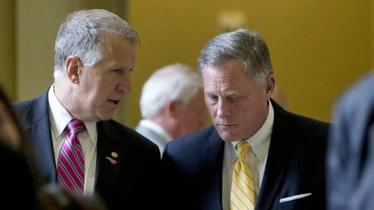 Senators Thom Tillis, left, and Richard Burr, right, leave a policy luncheon on Capitol Hill in 2015. Amid the coronavirus pandemic, millions of unemployed Americans and those who face eviction are calling on U.S. senators to pass another coronavirus relief bill.
