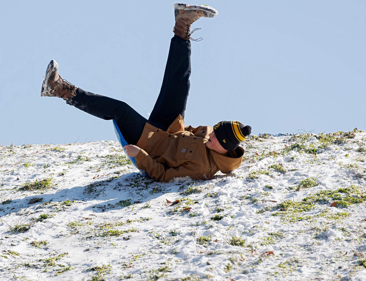 Grady Otterman sleds down a hill at Bond Park on Wednesday, Jan. 22, 2025, in Cary, N.C. After going without snow for nearly three years, Raleigh and the Triangle have seen a series of storms this season with wintry precipitation.