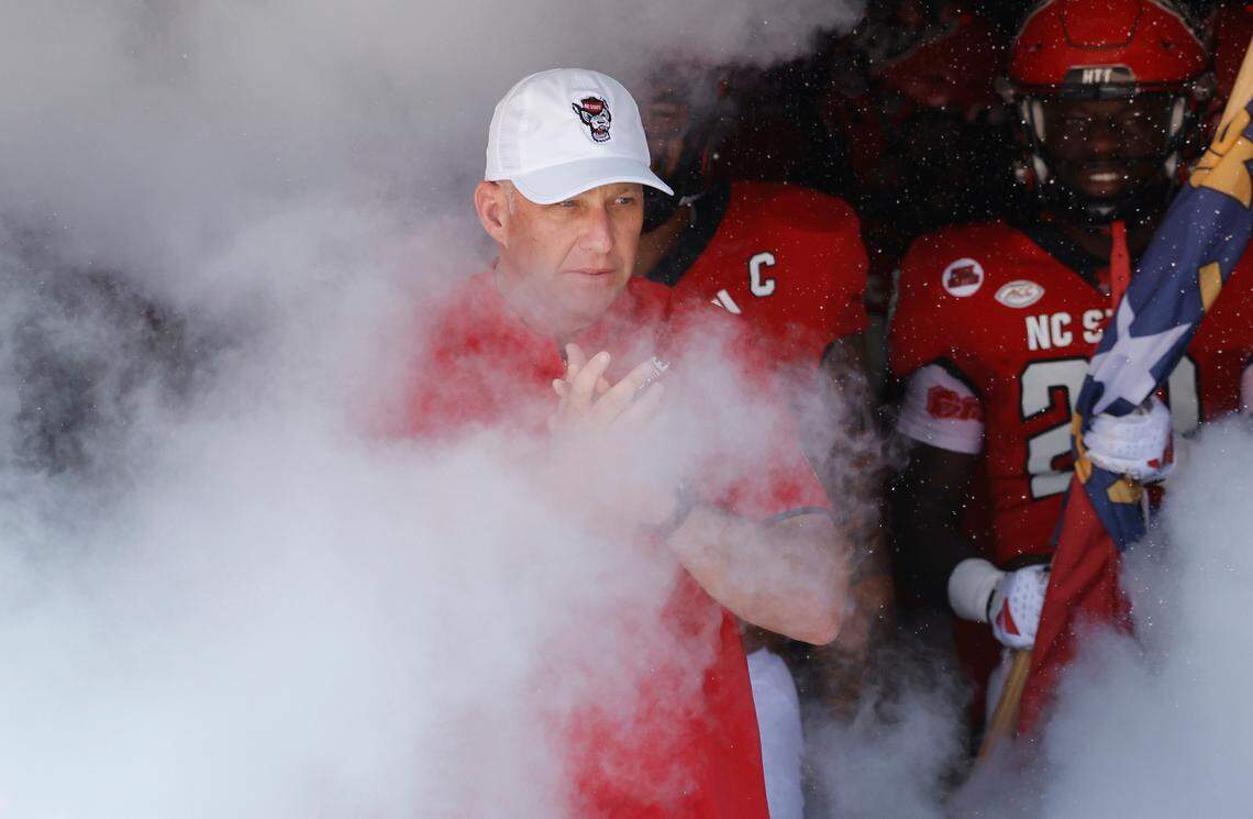 N.C. State head coach Dave Doeren leads his team out onto the field before the Wolfpack’s game against VMI at Carter-Finley Stadium in Raleigh, N.C., Saturday, Sept. 16, 2023.