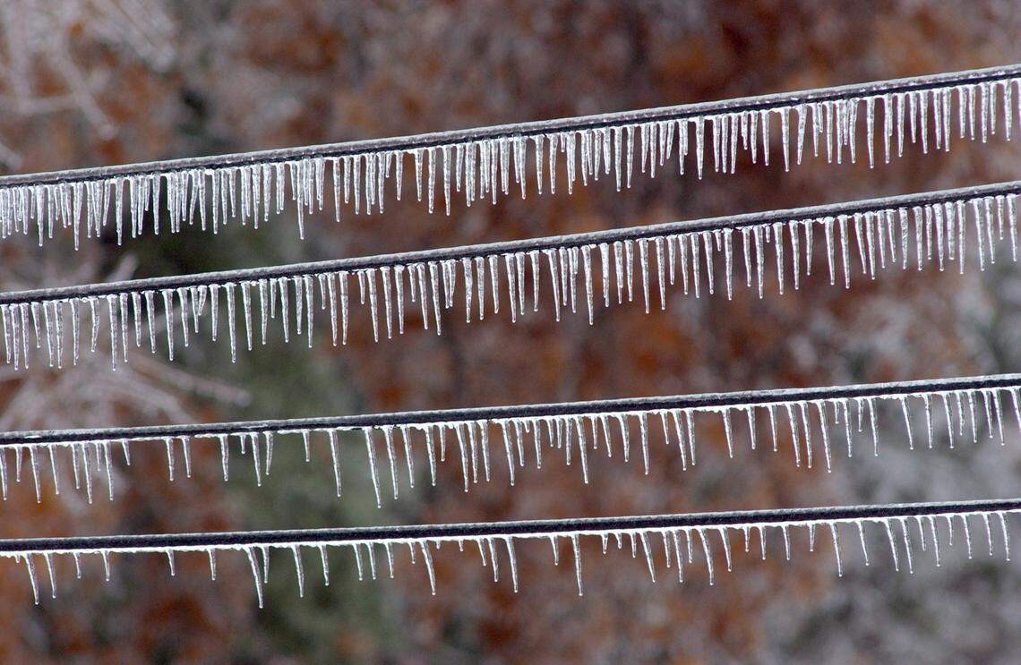 Ice coats power lines in northern Durham County. The ice build up has caused power lines to break as well as tree limbs to fall on the lines, causing widespread power outages in the Triangle area.