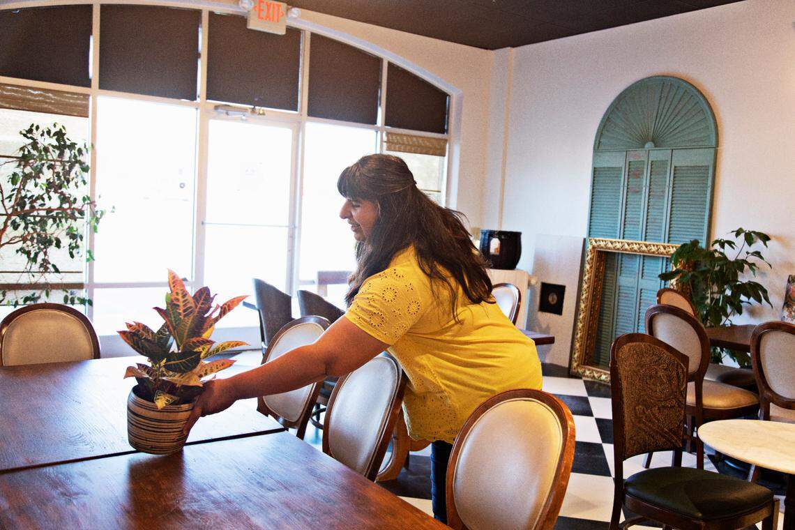 Preeti Waas adds finishing touches Friday, March 18, 2022, to her soon-to-open Cheeni Indian Food Emporium in North Raleigh’s Falls River Shopping Center.