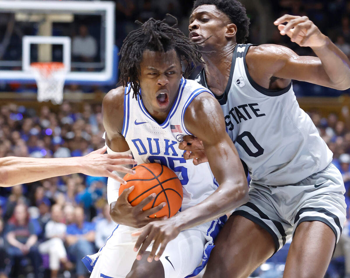 Duke’s Mark Mitchell (25) drives by USC Upstate’s Khydarius Smith (0) during the first half of Duke’s game against USC Upstate at Cameron Indoor Stadium in Durham, N.C., Friday, Nov. 11, 2022.
