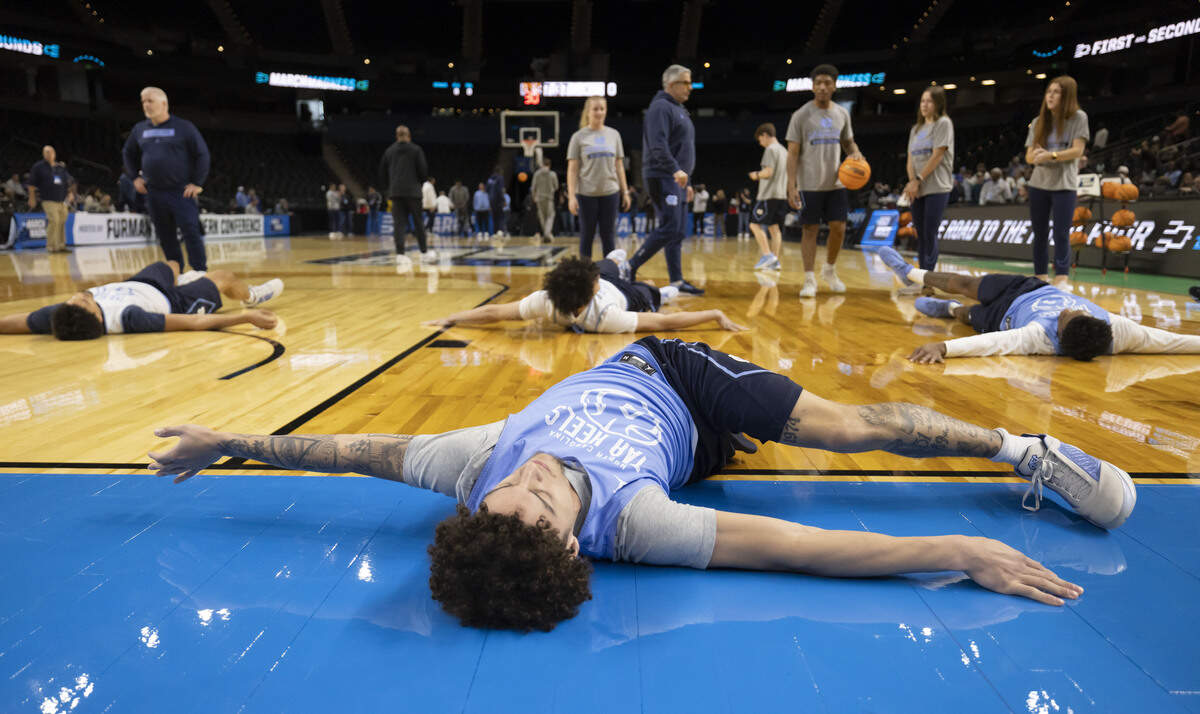 North Carolina guard Kyan Evans (0) stretches during the Tar Heels’ practice on Wednesday, March 18, 2026 in Greenville, S.C.  North Carolina will face VCU in the opening round of the NCAA Tournament.