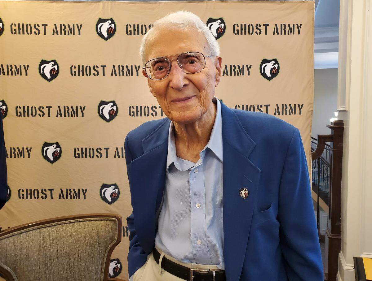 George Dramis, World War II veteran of the long-classified “Ghost Army” that faked the whereabouts of U.S. Army divisions in the days after the D-Day invasion at Normandy in 1944. Dramis is a recipient of the Congressional Gold Medal for his service in a precursor to today’s Army Psy Ops. Dramis is pictured at a ceremony Saturday, July 23, 2022, which was proclaimed George Dramis Day in Raleigh, N.C.