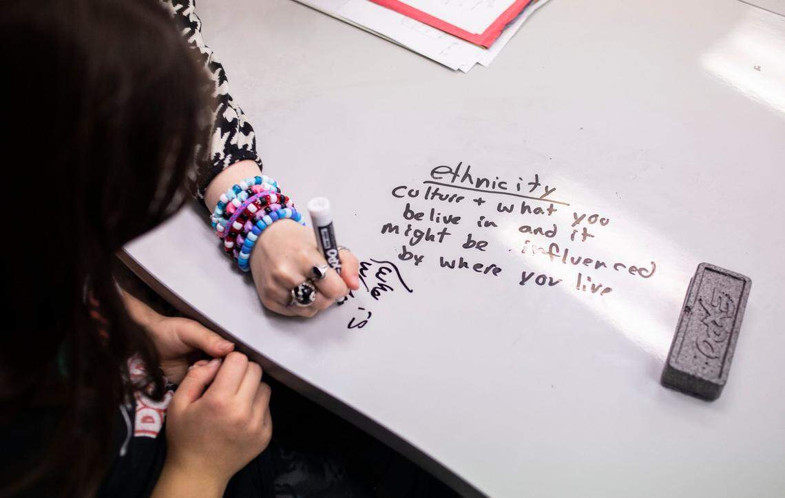 Students discuss the definition of ethnicity while learning African history in their 7th grade social studies class at McDougle Middle School in Chapel Hill, N.C. on Friday, Feb. 18, 2022.