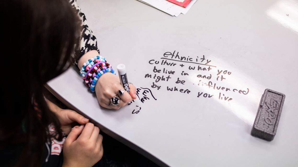 Students discuss the definition of ethnicity while learning African history in their 7th grade social studies class at McDougle Middle School in Chapel Hill, N.C. on Friday, Feb. 18, 2022.