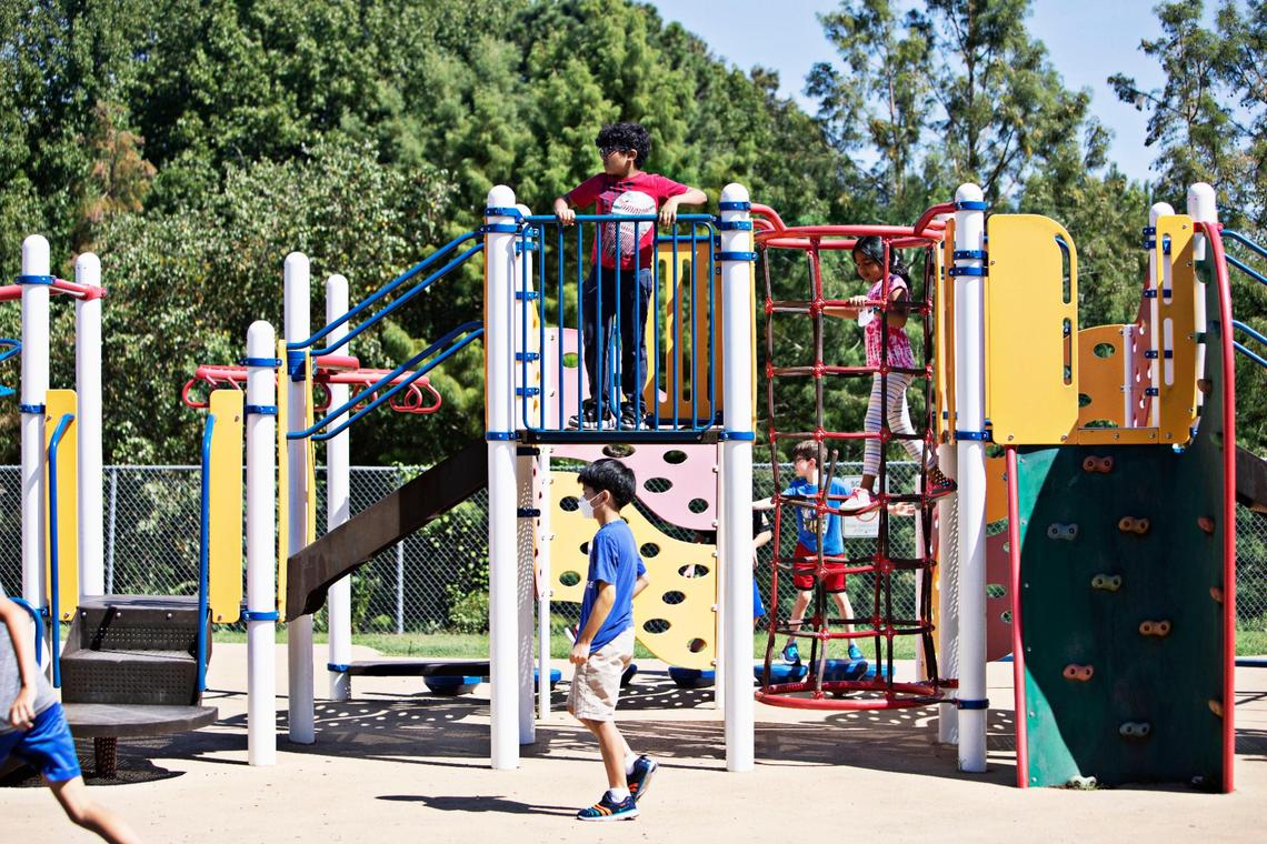 Students are given the option of taking their masks off during outdoor recess at Carpenter Elementary School in Cary on Thursday morning, Aug. 19, 2021. North Carolina students will start their third school year dealing with the coronavirus pandemic just as the highly contagious delta variant is rapidly spreading across the state.
