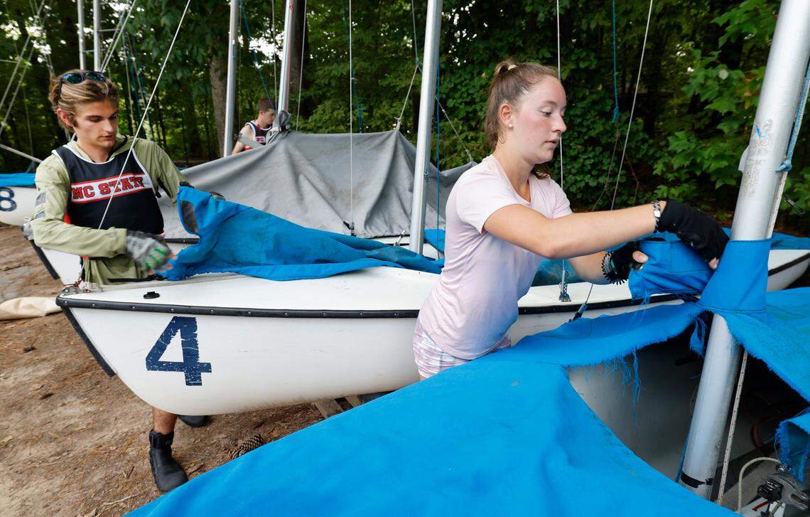 From left Ryan Brelage, Hunter Wheary and Olivia Soucy de-rig sailboats after N.C. State sailing team practice at Lake Crabtree in Morrisville, N.C., Friday, Sept. 6, 2024.