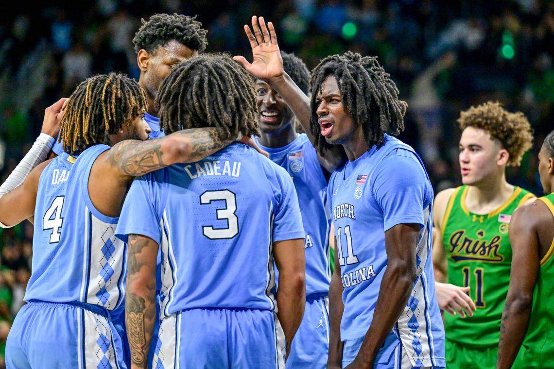North Carolina Tar Heels guard Elliot Cadeau (3) celebrates with his teammates after making a three-point basket in the second half against the Notre Dame Fighting Irish at the Purcell Pavilion.
