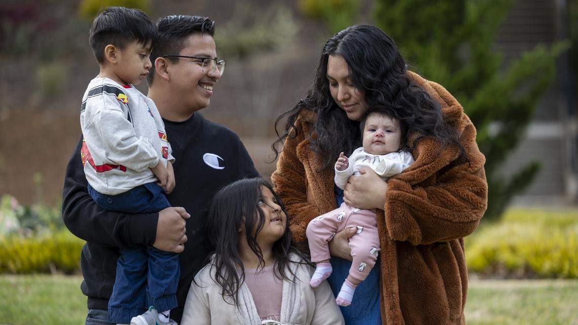 Moises Benitez Diaz, who came to the Triangle with his parents from Mexico when he was 5 years old, visits a Raleigh park with his wife, Esmeralda Escobar Vazquez, and their children, Elijah, 3, Rochelle, 5 and Eliana, 3-month-old, on Friday, March 13, 2026. Benitez Diaz was one of at least 370 people detained during a November 2025 immigration sweep that started in Charlotte and extended to the Triangle, dubbed “Operation Charlotte’s Web.” He was held at D. Ray James Correctional Facility in Folkston, Georgia, for three months and was released Feb. 27 on an $8,500 bond.