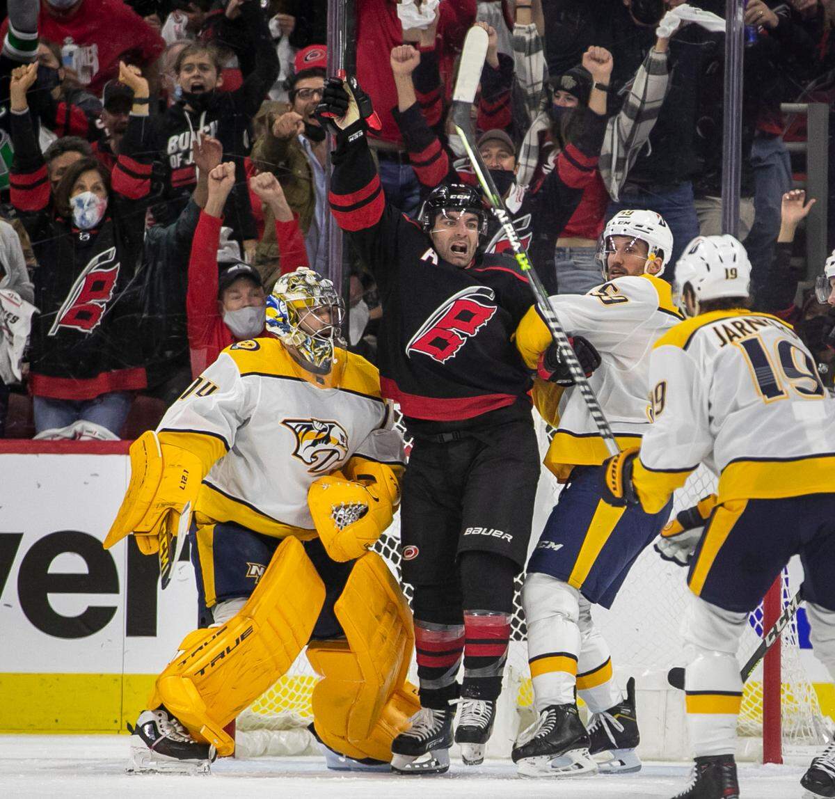Carolina Hurricanes’ Jordan Martinhook (48) reacts after a goal by Teuvo Teravainen (86) during the first period to tie Nashville 1-1 in their first round Stanley Cup series game on Monday, May 17, 2021 at PNC Arena in Raleigh, N.C.