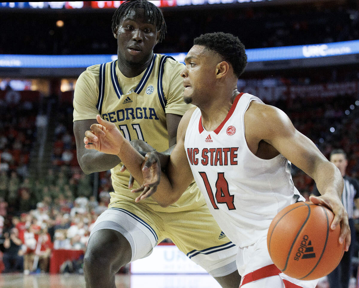 N.C. State’s Casey Morsell drives past Georgia Tech’s Baye Ndongo during the second half of the Wolfpack’s 82-76 win on Saturday, Feb. 3, 2024, at PNC Arena in Raleigh, N.C.