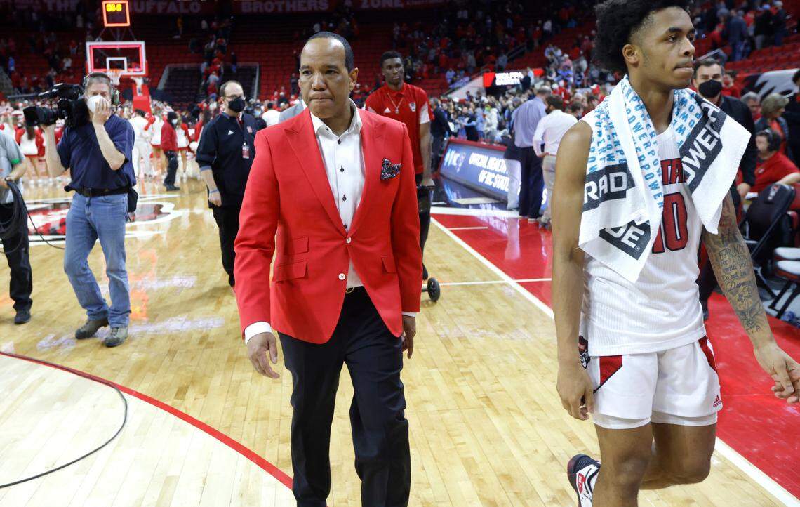 N.C. State head coach Kevin Keatts and Breon Pass (10) walk off the court after UNC’s 84-74 victory over N.C. State at PNC Arena in Raleigh, N.C., Saturday, Feb. 26, 2022.