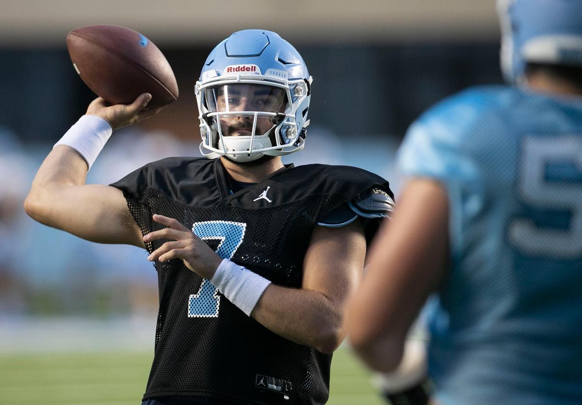 North Carolina quarterback Sam Howell (7) warms up during the Tar Heels’ practice in Kenan Stadium on Monday August 19, 2019 in Chapel Hill, N.C. UNC opened their practice to the public on Monday night under the lights in Kenan.